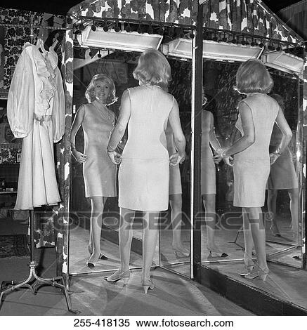 Women trying on dress View Large Photo Image Stock Photography - Women trying on dress. Fotosearch