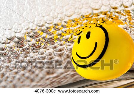Yellow marble with smiley face in soap suds View Large Photo Image Stock Image - Yellow marble with smiley face in soap suds. Fotosearch