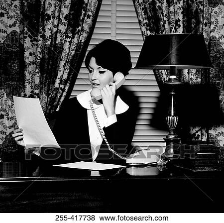 Young businesswoman using telephone View Large Photo Image Stock Photo - Young businesswoman using telephone. Fotosearch
