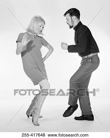 Stock Photo - Young couple disco dancing. Fotosearch