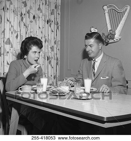 Young couple having supper View Large Photo Image Stock Image - Young couple having supper. Fotosearch