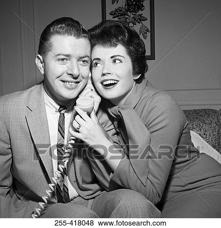 Young couple on the phone View Large Photo Image Stock Photo - Young couple on the phone. Fotosearch