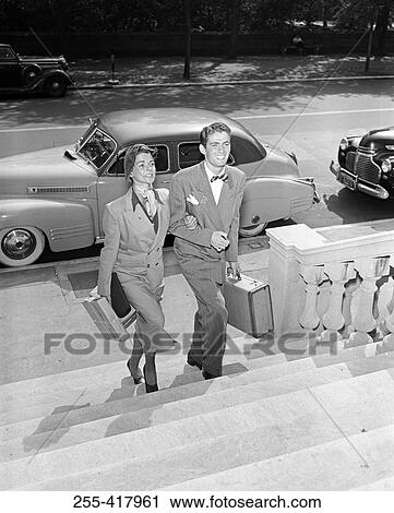 Young couple walking on steps View Large Photo Image Stock Image - Young couple walking on steps. Fotosearch