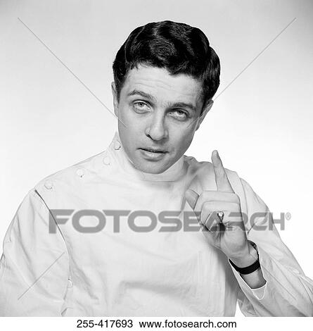 Stock Image - Young doctor explaining. Fotosearch