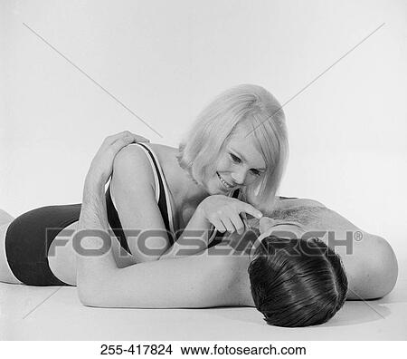 Young semi-dress couple lying on floor View Large Photo Image Picture - Young semi-dress couple lying on floor. Fotosearch
