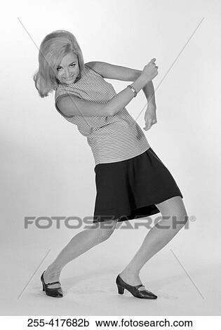 Young woman bouncing View Large Photo Image Stock Image - Young woman bouncing. Fotosearch