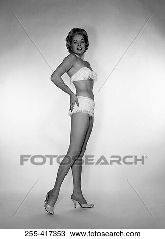Young woman wearing bikini, studio shot View Large Photo Image Stock Image - Young woman wearing bikini, studio shot. Fotosearch