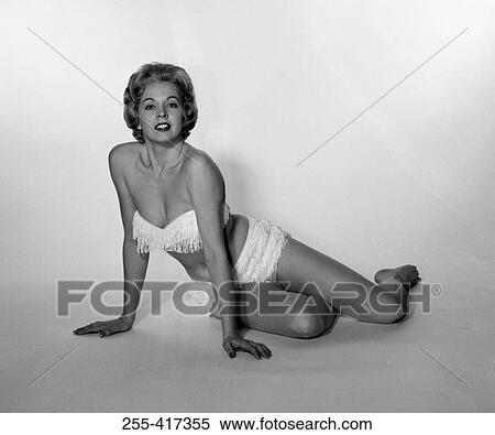 Young woman wearing bikini, studio shot View Large Photo Image Stock Photography - Young woman wearing bikini, studio shot. Fotosearch