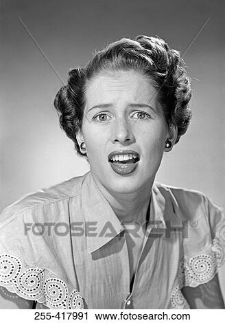 Young woman with mouth open, portrait View Large Photo Image Stock Image - Young woman with mouth open, portrait. Fotosearch
