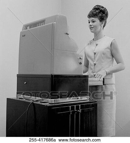 Young woman working on till View Large Photo Image Stock Image - Young woman working on till. Fotosearch