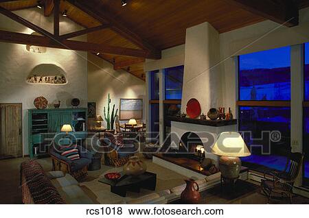 Interior View Of A Santa Fe Style Living Room With A Fireplace