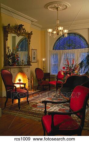 Interior View Of Victorian Style Living Room With A Fireplace And