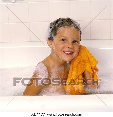 Little Boy Taking A Bubble Bath With Shampoo In His Hair And Is