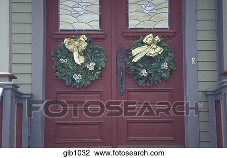 Two Christmas Wreaths Decorate The Double Doors Of An Old House In Fayetteville Arkansas Stock Image