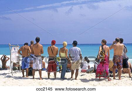 Mexico Playa Del Carmen Yucatan Group Of People On The Beach Looking Out To The Sea Stock Photography Ccc2145 Fotosearch