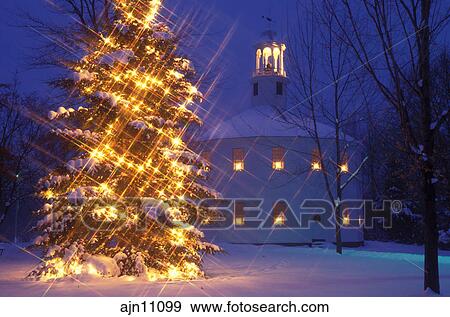 Vermont, Christmas, church, tree, White star lights decorate an evergreen tree in front of the ...