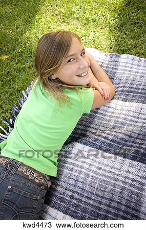 Portrait Of A Girl Lying On A Mat In Lawn Stock Image Kwd4473