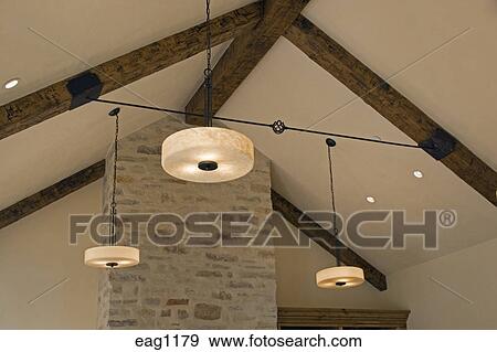 A Wrought Iron Turnbuckle And Open Beam Ceiling With