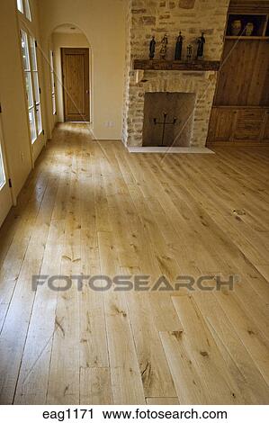 Hard Wood Floor And Stone Fireplace In Living Room California