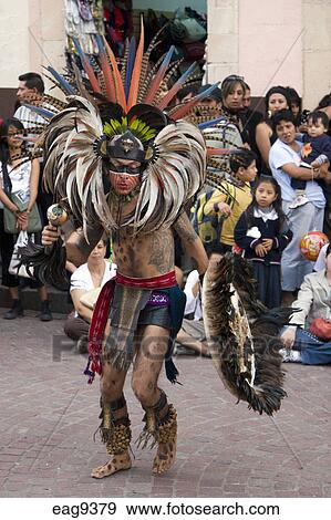 Stock Photograph of An AZTEC DANCER dressed as a WARRIOR with headdress ...