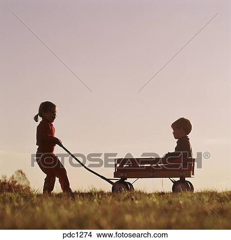 girl pulling wagon
