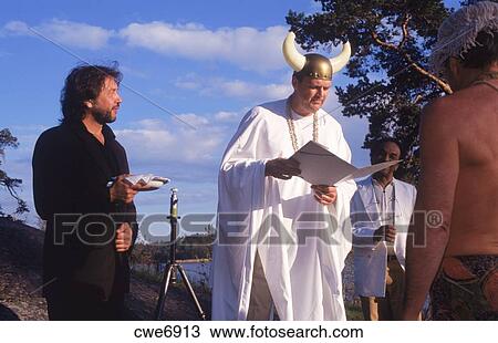 Big Viking Priest With Headgear And Horns Reading Wedding Vows During Humorous Wedding On Island In Stockholm Sweden Stock Image Cwe6913 Fotosearch