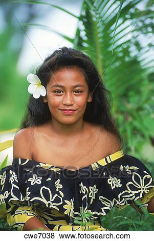 Young Polynesian girl in local dress on Aitutaki in Cook Islands Stock