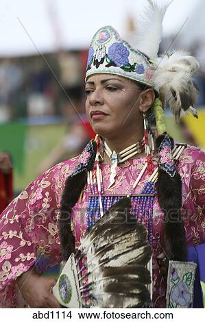 Stock Photo of A Native American woman dances in full traditional ...