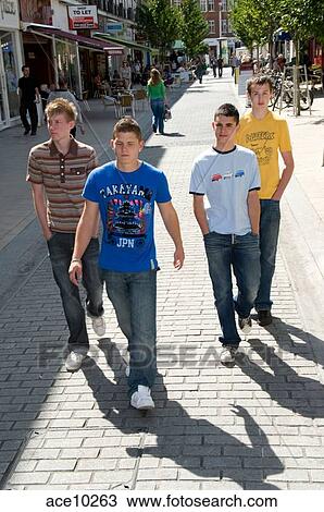4 teenage boys walking in the high street Stock Image | ace10263 |  Fotosearch