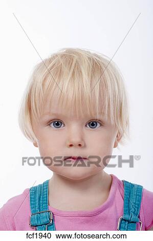 Portrait Of A Little Girl With Blond Hair And Blue Eyes Isolated
