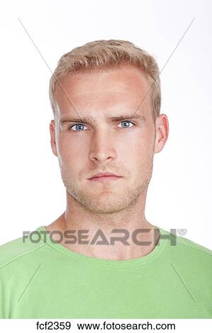 Portrait Of A Young Man With Blond Hair And Blue Eyes Isolated