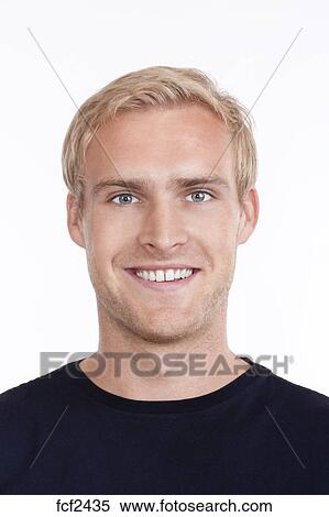 Portrait Of A Young Man With Blond Hair And Blue Eyes Isolated