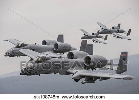 A-10 Thunderbolt II's in flight over Arkansas. View Large Photo Image Picture - A-10 Thunderbolt II's in flight over Arkansas.. Fotosearch