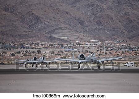 A-10 Thunderbolts taxi to the runway at Nellis Air Force Base, Nevada. View Large Photo Image Picture - A-10 Thunderbolts taxi to the runway at Nellis Air Force Base, Nevada.. Fotosearch