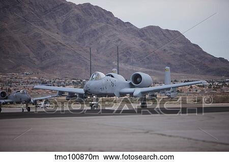 Picture - A-10 Thunderbolts taxi to the runway at Nellis Air Force Base, Nevada.. Fotosearch