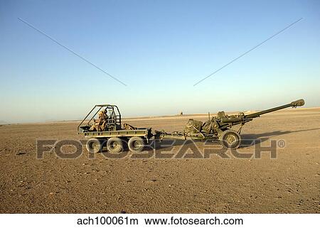 A 105mm light gun being towed by an all-terrain vehicle. View Large Photo Image Picture - A 105mm light gun being towed by an all-terrain vehicle.. Fotosearch