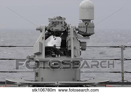 A 25mm machine gun is fired aboard USS Blue Ridge. View Large Photo Image Picture - A 25mm machine gun is fired aboard USS Blue Ridge.. Fotosearch