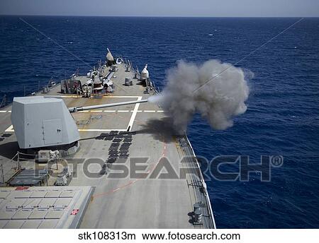 A 5-inch gun is fired aboard USS Roosevelt. View Large Photo Image Picture - A 5-inch gun is fired aboard USS Roosevelt.. Fotosearch