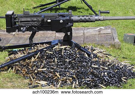 A. 50 Caliber Browning Machine Gun with a pile of spent cases and links. View Large Photo Image Picture - A. 50 Caliber Browning Machine Gun with a pile of spent cases and links.. Fotosearch