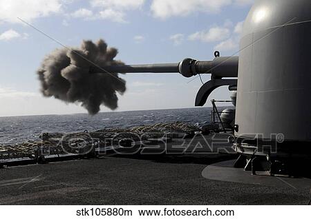 A 76mm cannon is fired aboard the guided missile frigate USS Simpson. View Large Photo Image Picture - A 76mm cannon is fired aboard the guided missile frigate USS Simpson.. Fotosearch