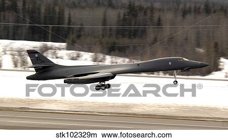 A B-1B Lancer performs a touch and go before landing. View Large Photo Image Picture - A B-1B Lancer performs a touch and go before landing.. Fotosearch