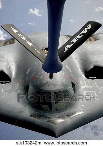 A B-2 Spirit aircraft getting in position to refuel from a KC-135 Stratotanker over the Pacific Ocean. View Large Photo Image Picture - A B-2 Spirit aircraft getting in position to refuel from a KC-135 Stratotanker over the Pacific Ocean. . Fotosearch