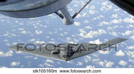 A B-2 Spirit approaches the refueling boom of a KC-135 Stratotanker. View Large Photo Image Picture - A B-2 Spirit approaches the refueling boom of a KC-135 Stratotanker.. Fotosearch