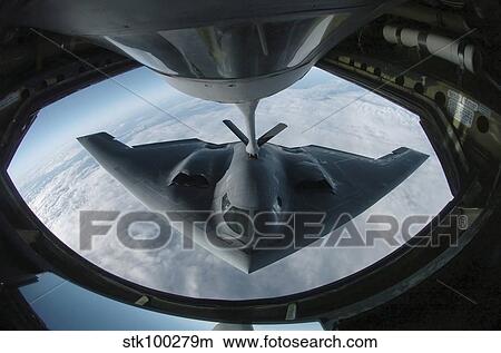 A B-2 Spirit bomber refuels from a KC-135 Stratotanker. View Large Photo Image Picture - A B-2 Spirit bomber refuels from a KC-135 Stratotanker.. Fotosearch