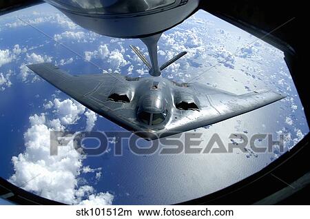 A B-2 Spirit moves into position for refueling from a KC-135 Stratotanker. View Large Photo Image Picture - A B-2 Spirit moves into position for refueling from a KC-135 Stratotanker.. Fotosearch