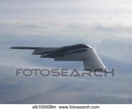 A B-2 Spirit soars through the sky. View Large Photo Image Picture - A B-2 Spirit soars through the sky.. Fotosearch