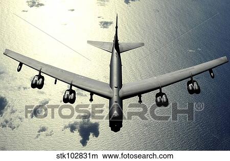 A B-52 Stratofortress in flight over the Pacific Ocean. View Large Photo Image Picture - A B-52 Stratofortress in flight over the Pacific Ocean.. Fotosearch