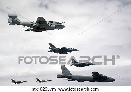 A B-52 Stratofortress leads a formation of aircraft over Guam. View Large Photo Image Picture - A B-52 Stratofortress leads a formation of aircraft over Guam.. Fotosearch