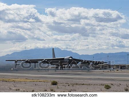 A B-52 Stratofortress takes off from Nellis Air Force Base. View Large Photo Image Picture - A B-52 Stratofortress takes off from Nellis Air Force Base.. Fotosearch
