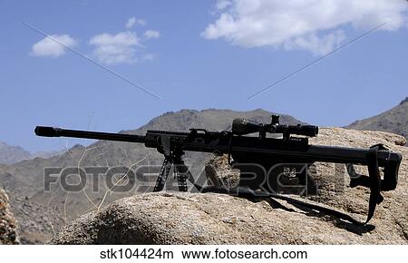 A Barrett. 50-caliber M107 Sniper Rifle sits atop an observation point in Afghanistan. View Large Photo Image Picture - A Barrett. 50-caliber M107 Sniper Rifle sits atop an observation point in Afghanistan.. Fotosearch